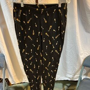 Torrid Black Leggings with Gold Champagne Print